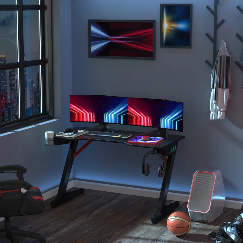 Black LED Gaming Desk with Z-Shaped Design and Storage Features