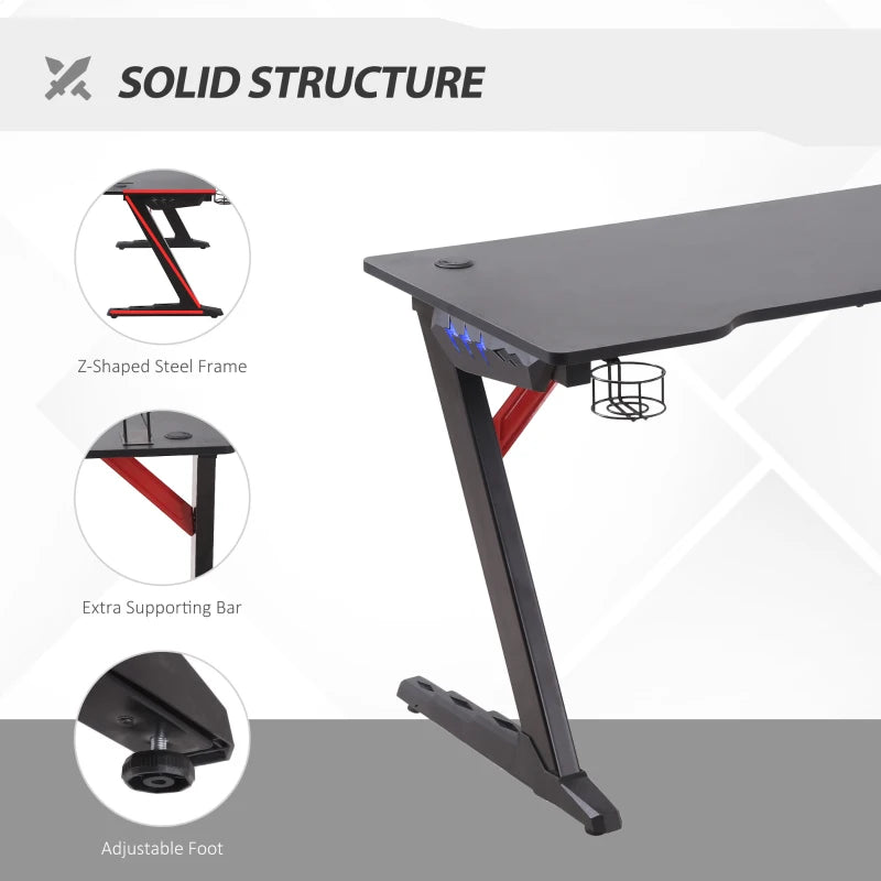 Black LED Gaming Desk with Z-Shaped Design and Storage Features